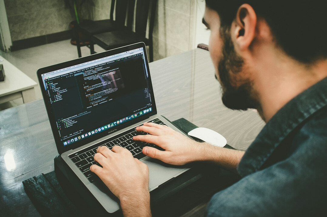 croatian student coding on laptop